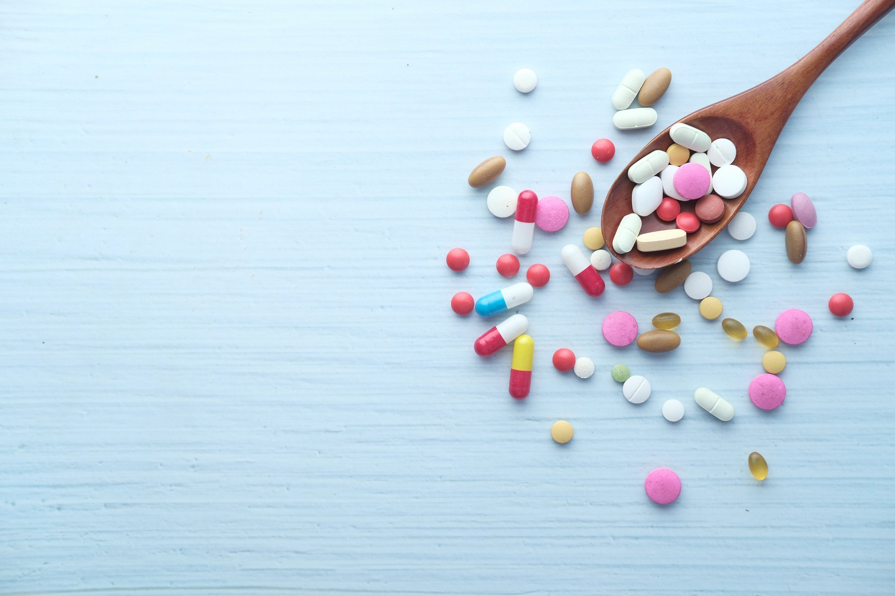 Top View of Colorful Pills on Spoon